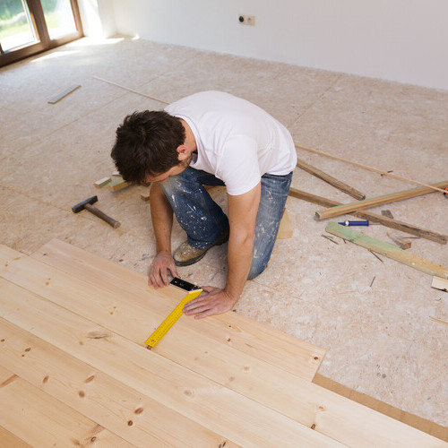 Contractor installs flooring